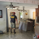 62-year-old Highlands resident Dwight Chandler, who lives near the flooded Highlands Acid Pit, examines his flood-damaged home. Photo: AP